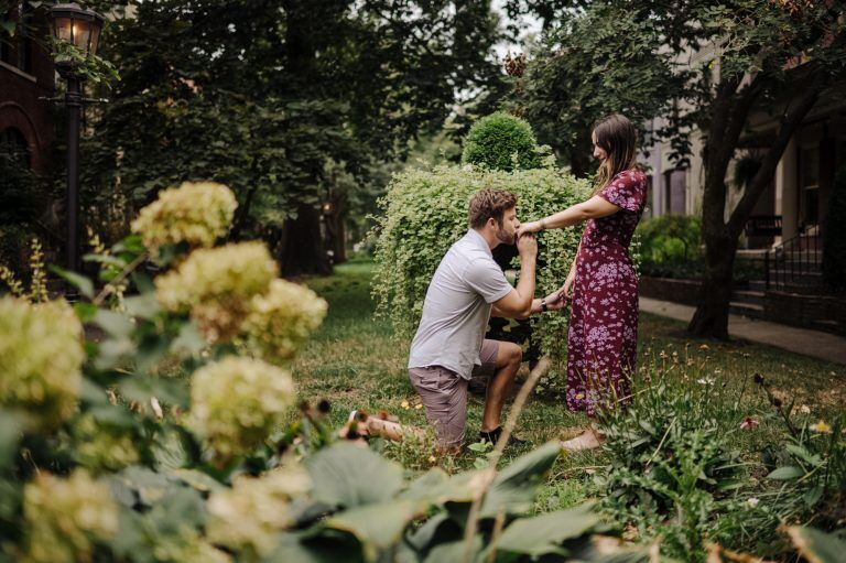 Man drops to a knee and proposes to the love of his life at St James Court in Louisville Kentucky