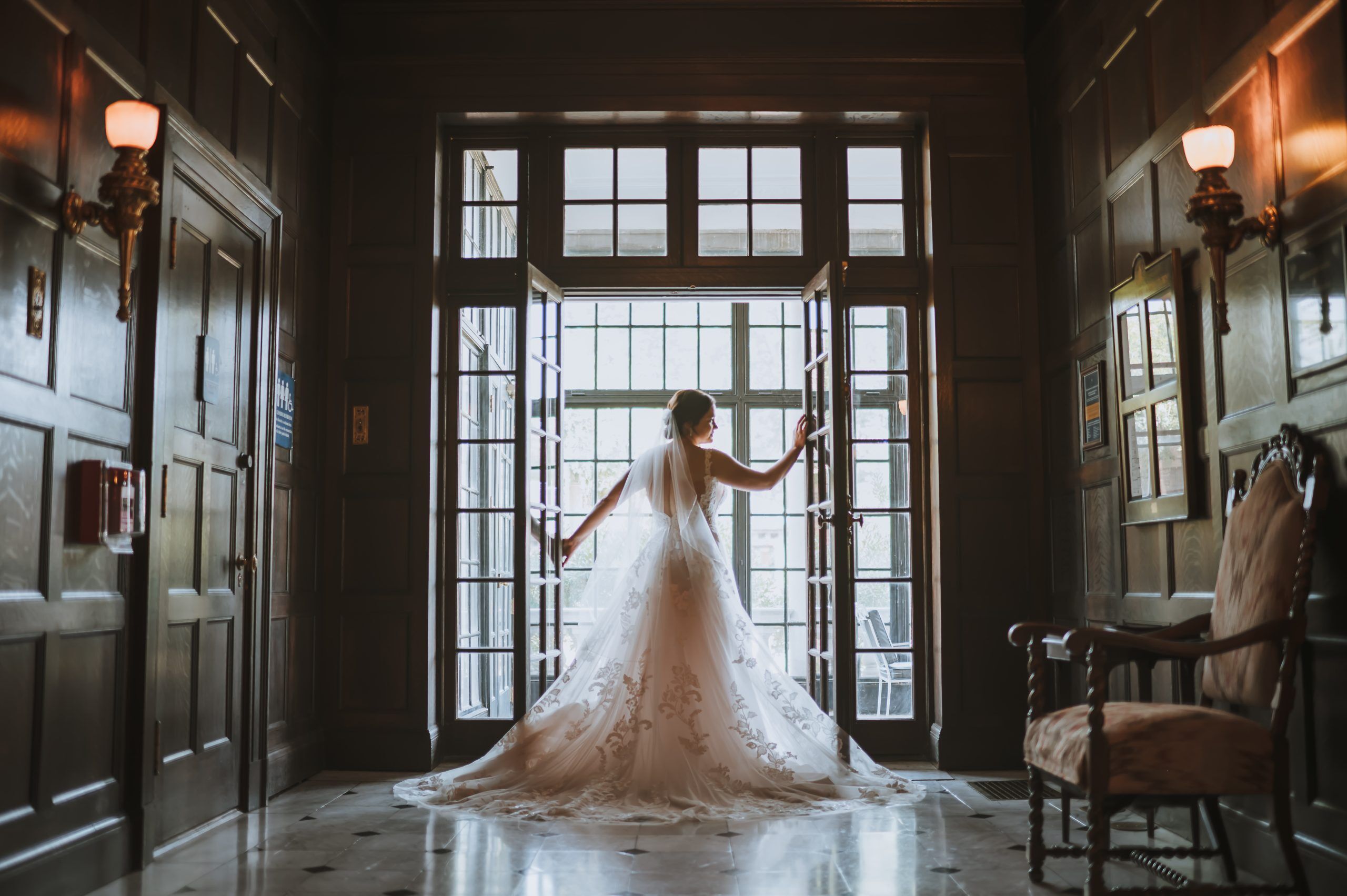 Bride poses in the atrium of Gardencourt in Louisville Kentucky