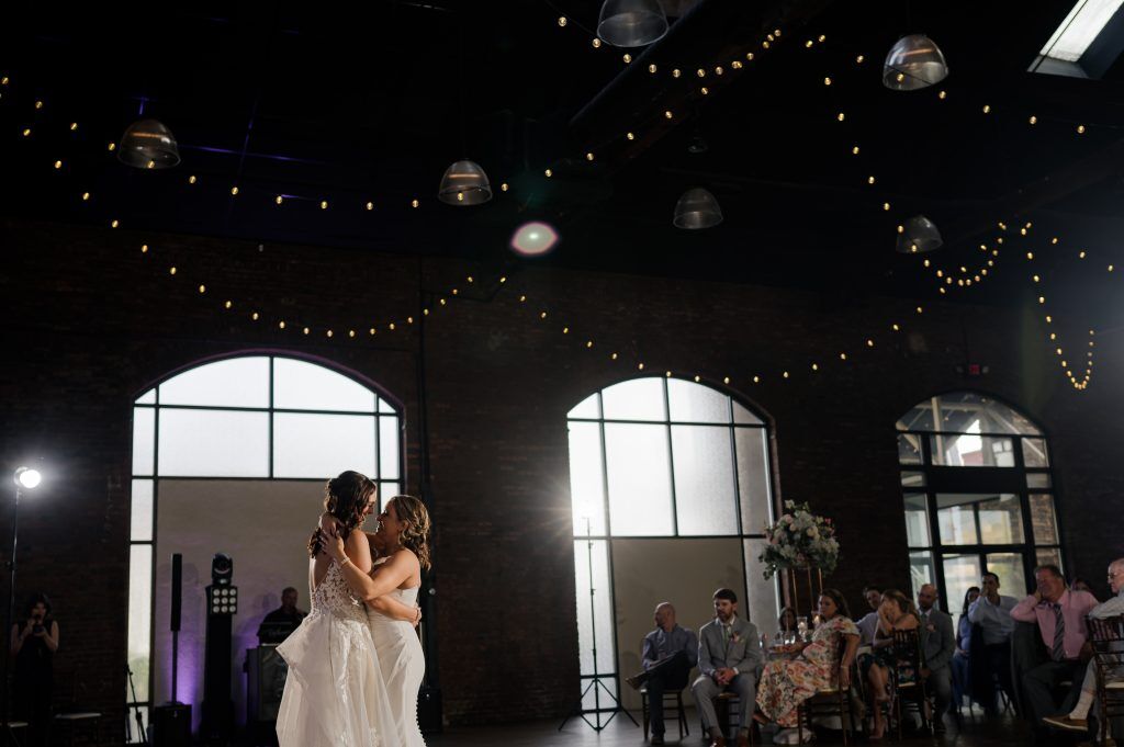bride and bride dance at the Refinery