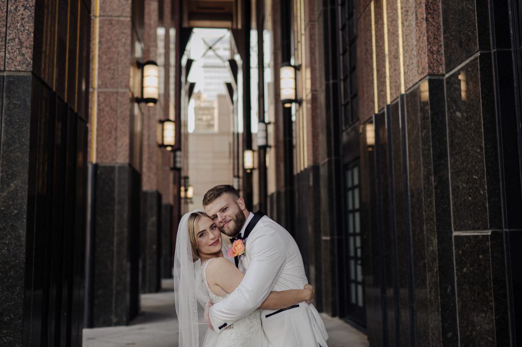 couple snuggles after their courthouse weddings