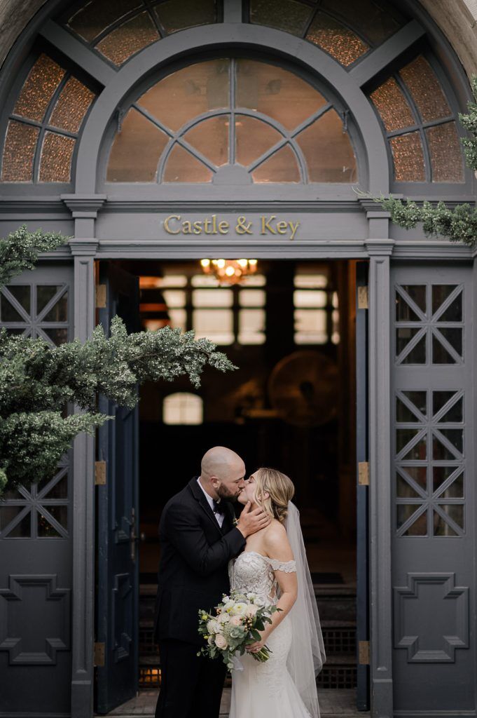 Louisville wedding photographers capture first kiss at Castle and Key Distillery
