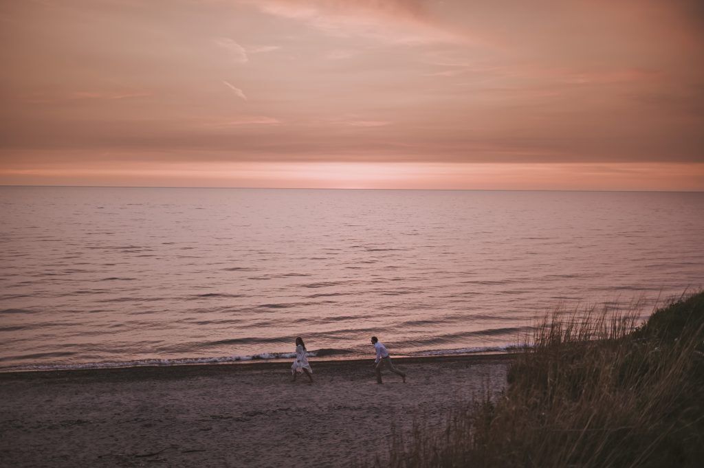 two people elope on the lakeshore of lake michigan